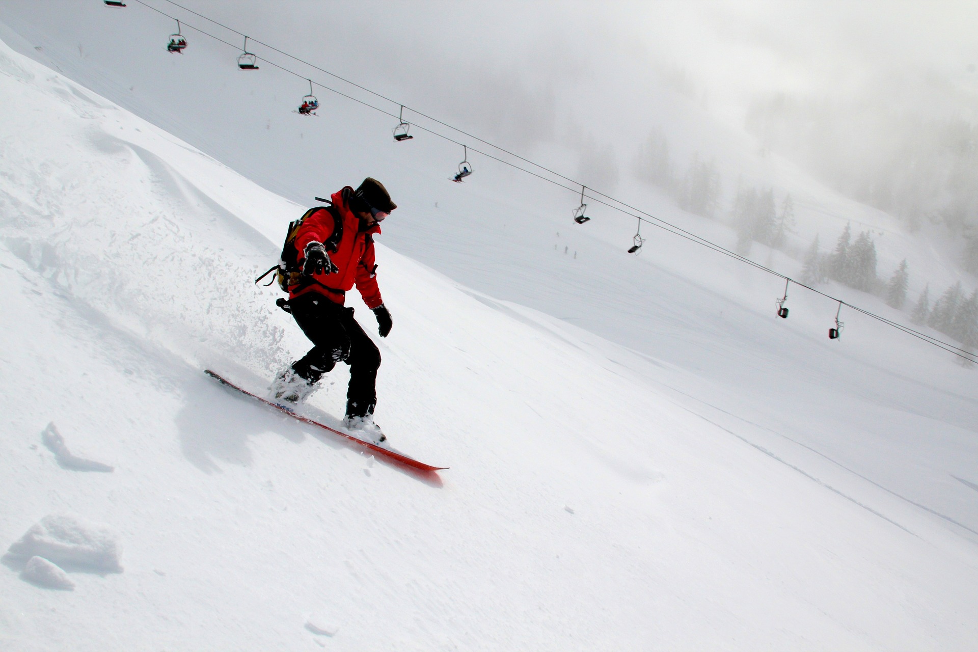 man snowboarding in new zealand